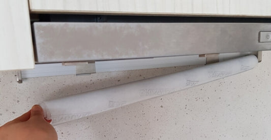 Renguard range hood filter protector installed on a kitchen hood