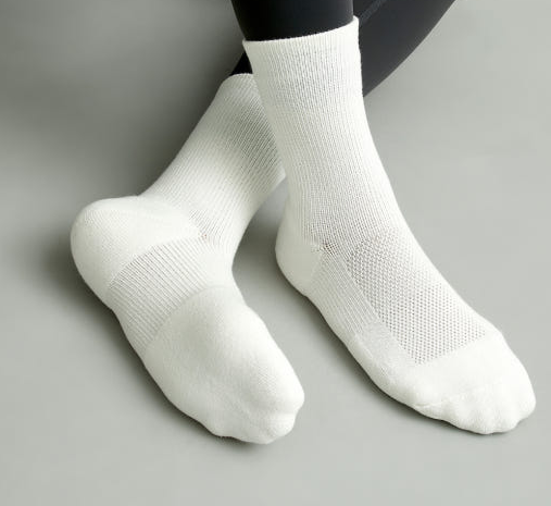 Close-up of patented L-shaped heel sports sock for arch and ankle support, showing 3D-stitched fit and elastic band